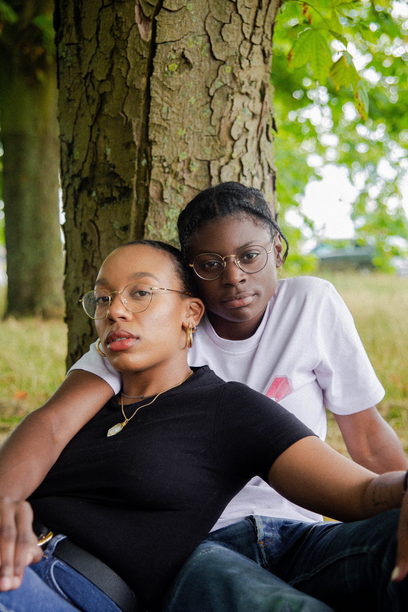 A couple sits embracing one another next to a tree. Learn how building self-esteem in Brooklyn, NY can offer support with your relationship by contacting an online therapist in Brooklyn, NY. Search therapist Brooklyn, NY to learn more today.