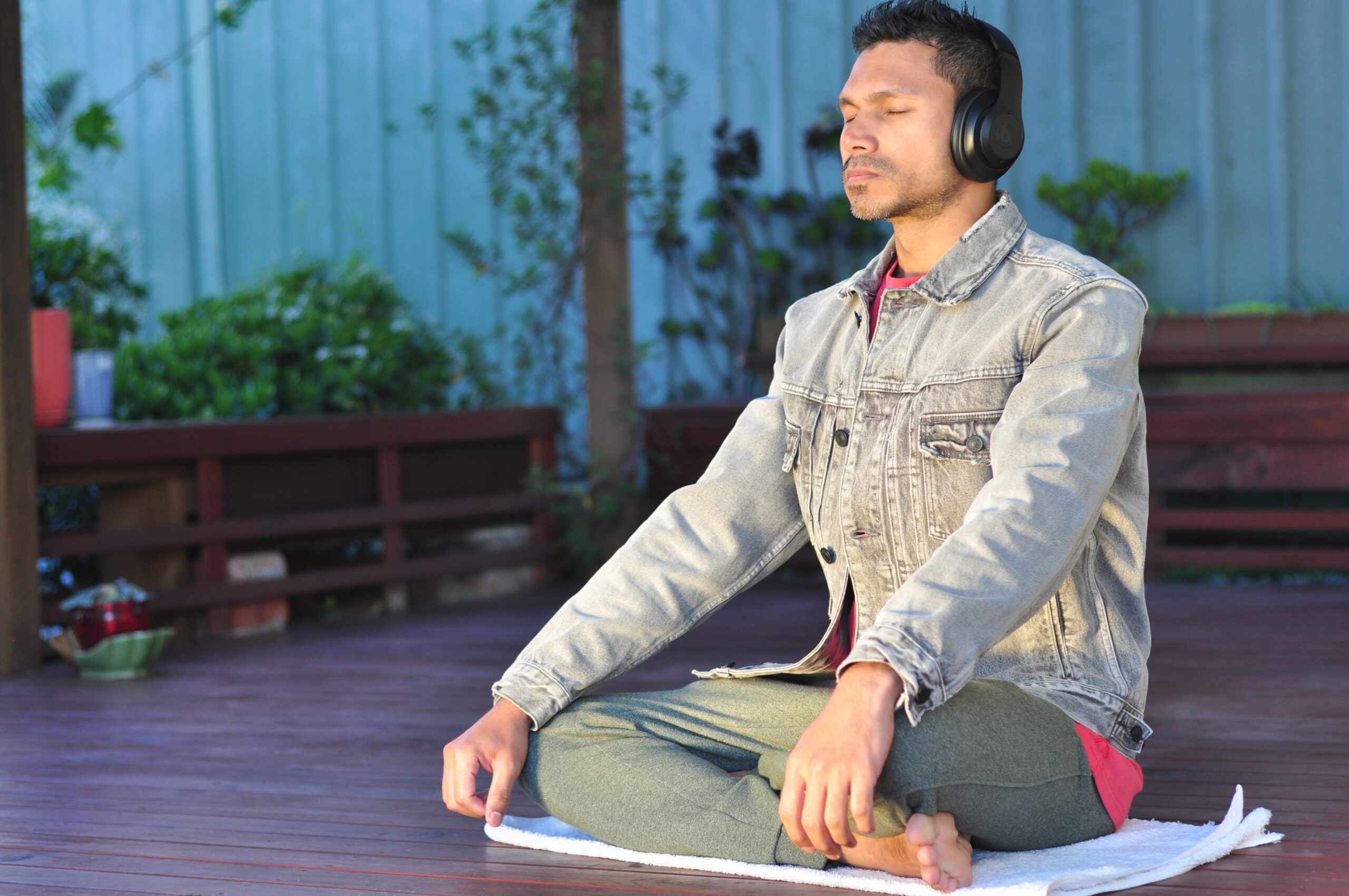 A man sits on a matt while meditating. This could represent a grounding technique an anxiety therapist in Brooklyn, NY can teach. Learn more about anxiety treatment in Brooklyn, NY or search black therapist near me today.