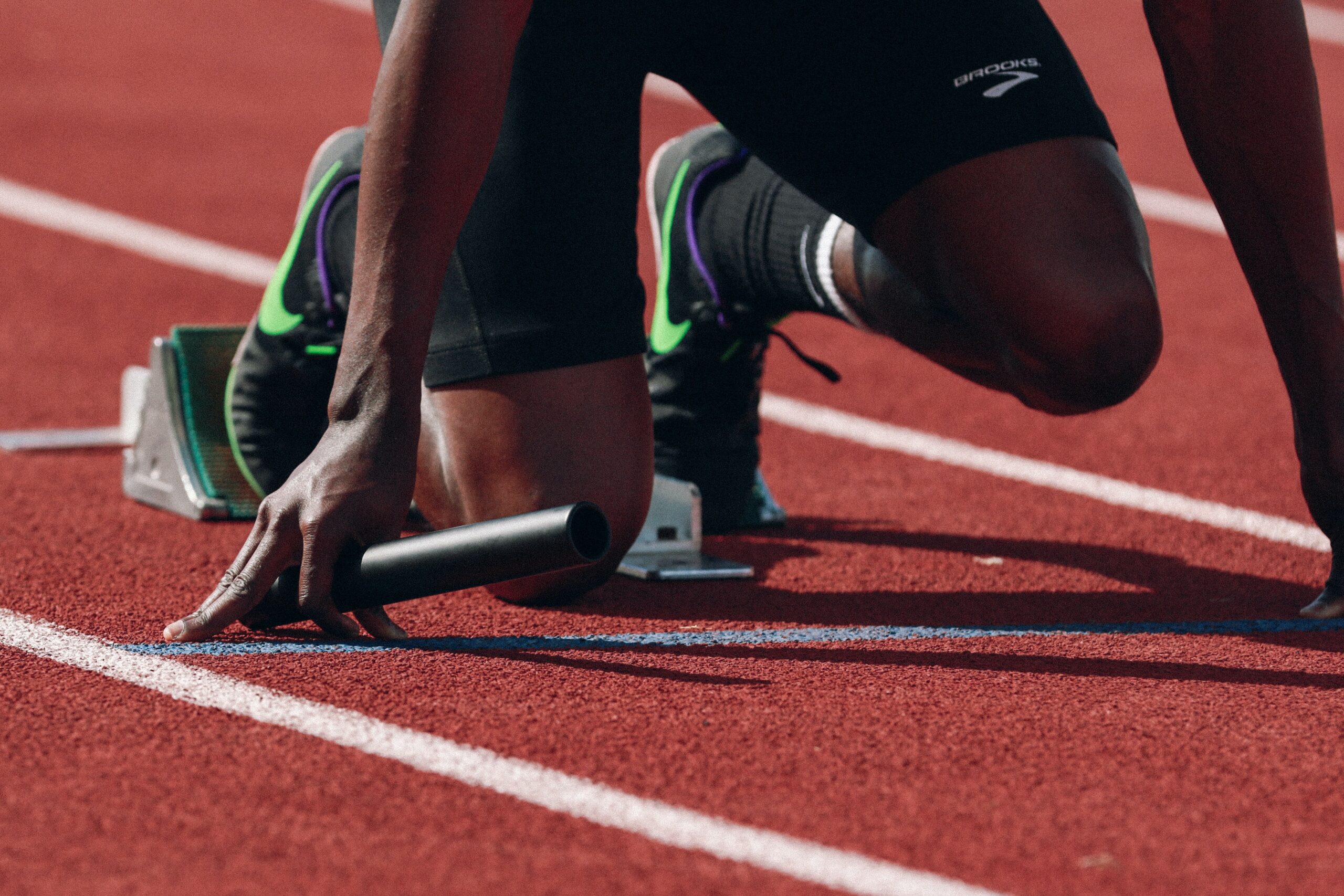 A close up of a runner on a starting block. Learn how therapy for people of color in Brooklyn, NY can offer support for athletes and more. Search for online therapy in New York to learn more about therapy in Bedstuy and other services. 