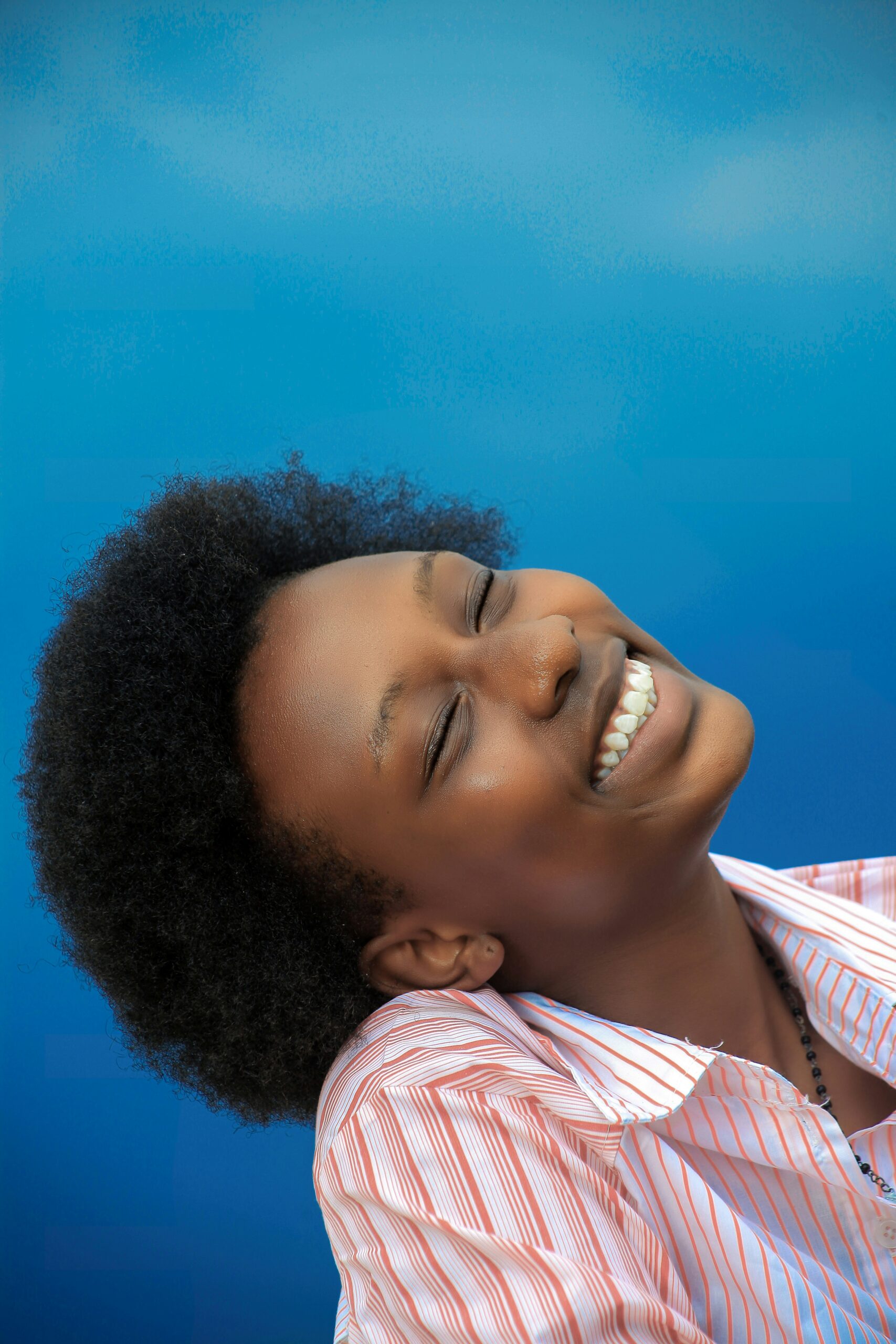 A joyful woman smiles brightly after progress through depression treatment in Brooklyn, NY with the support of a black therapist in Brooklyn, NY providing expert therapy for depression in Brooklyn, NY.